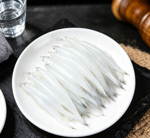 Fresh silver fish on a white plate