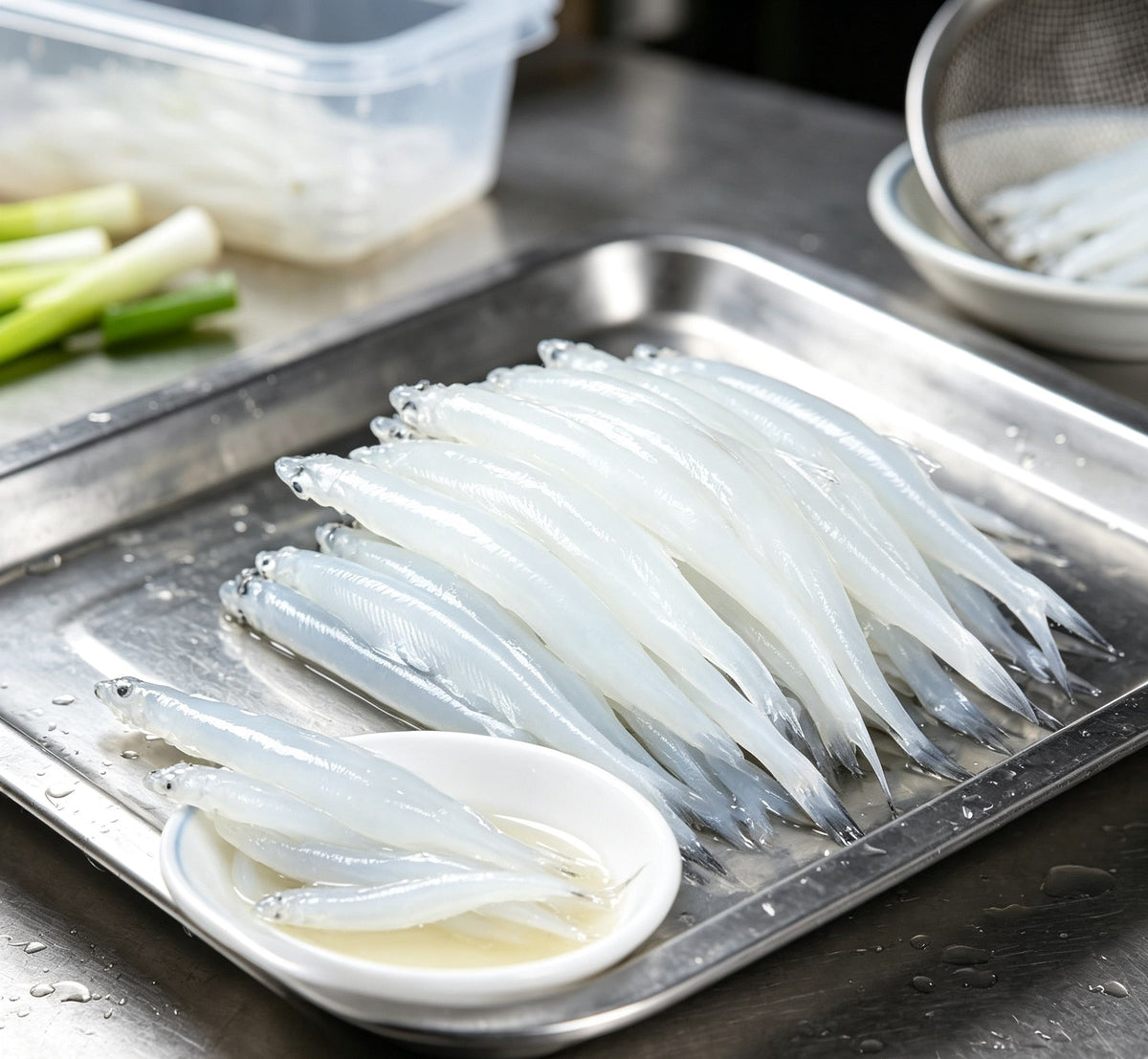 Fresh silver fish on a white plate